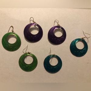 Three pairs of hoop earrings. Purple, green, and turquoise.